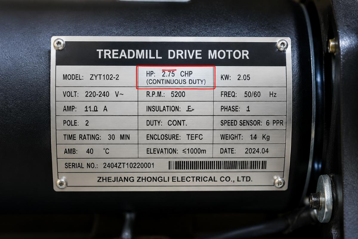 Close-up of a treadmill motor nameplate showing continuous duty horsepower rating